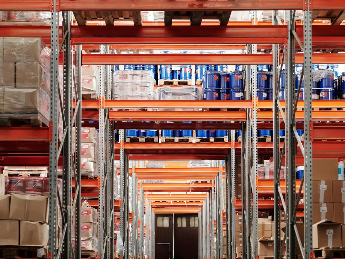 Industrial warehouse aisle lined with shelving